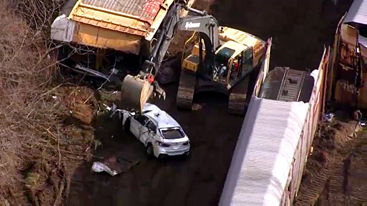 BMWs wrecked in train crash
